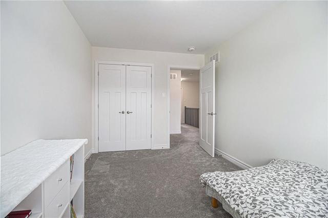 The second bedroom boasts double closet doors, offering ample storage space while maintaining a sleek & organized aesthetic. | Image 15