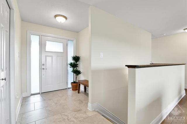 Bright foyer with access to mud room area and laundry | Image 4