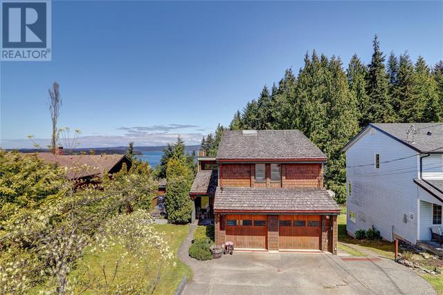 2736 Woodland Dr, House detached with 4 bedrooms, 3 bathrooms and 5 parking in Port McNeill BC | Card Image