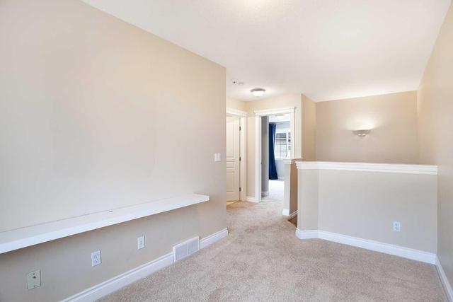 71 Cougar Ridge Mews Sw, Home with 2 bedrooms, 1 bathrooms and 2 parking in Calgary AB | Image 19