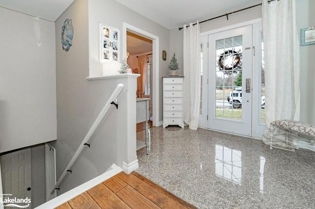 The stairs to the basement are just off the front foyer | Image 28