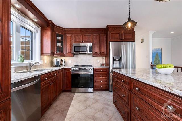 Kitchen with new granite countertops and garburator | Image 7