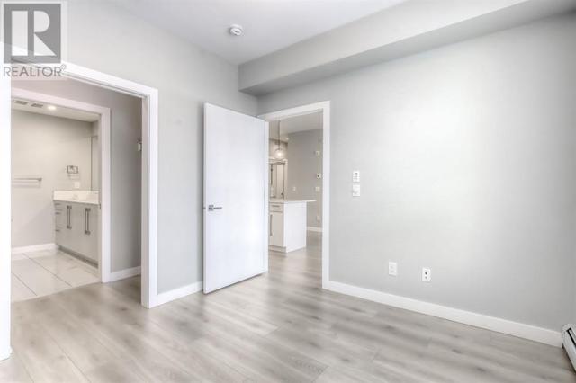303, - 383 Smith Street Nw, Condo with 1 bedrooms, 2 bathrooms and 1 parking in Calgary AB | Image 9