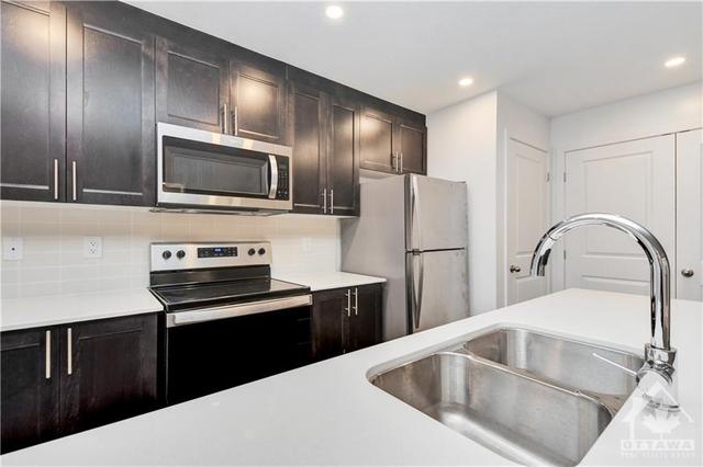 b - 310 Tulum Crescent, House attached with 2 bedrooms, 2 bathrooms and 1 parking in Ottawa ON | Image 13