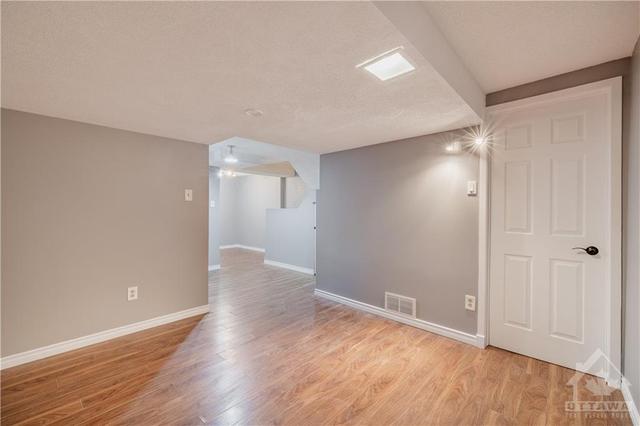 Wonderful extra space in lower level recreation room. | Image 24