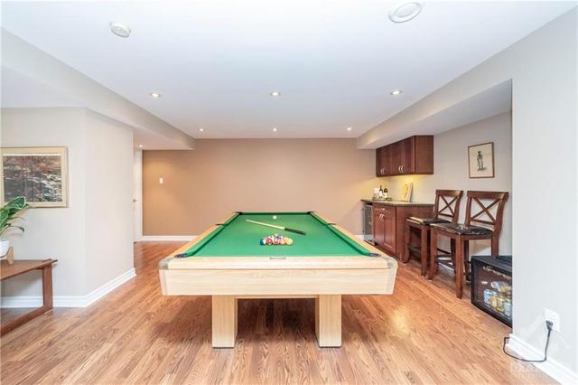 Beautifully finished basement features a bar area, games area and designed for ultimate relaxation! | Image 22