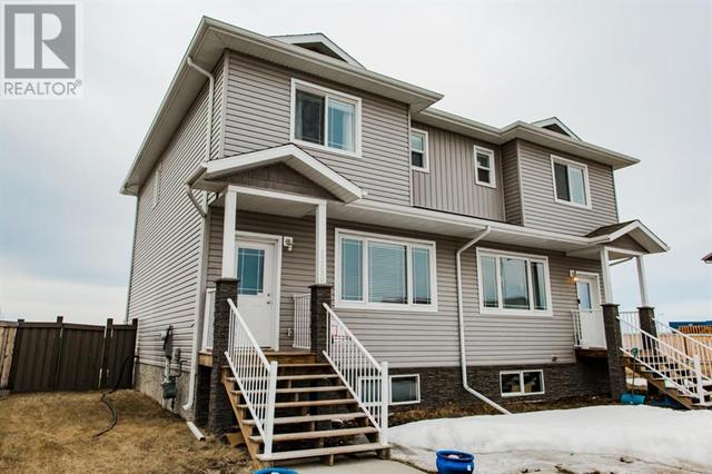 12650 103b Street, House semidetached with 3 bedrooms, 2 bathrooms and 2 parking in Grande Prairie AB | Card Image