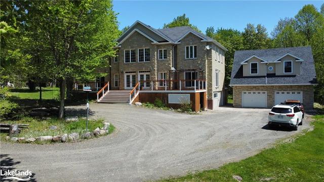House and front deck and oversized garage | Image 1