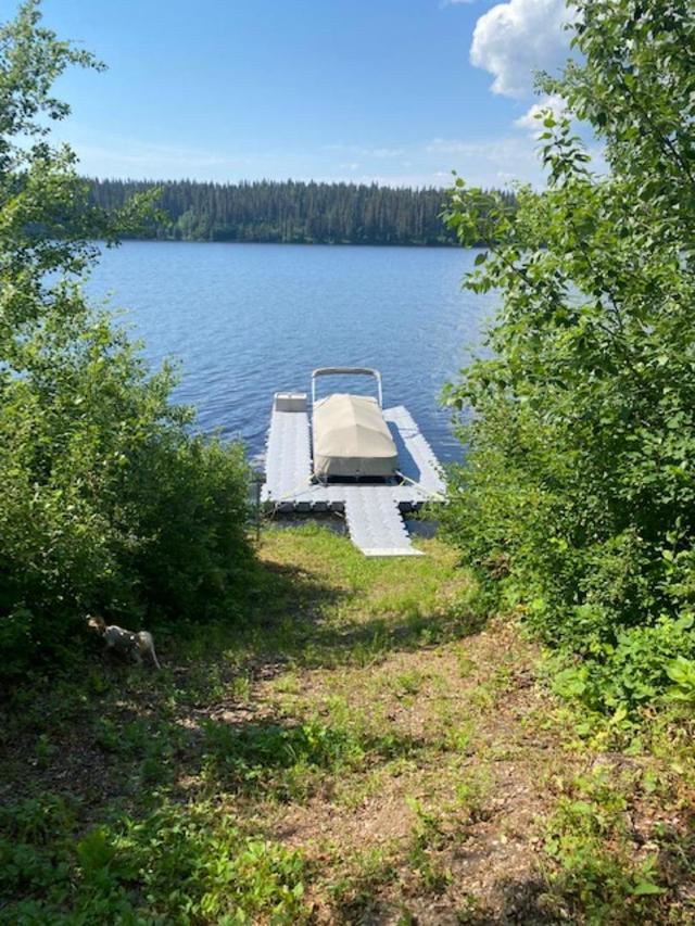 View from path down to lake.  Boat & dock are not included in the sale | Image 40