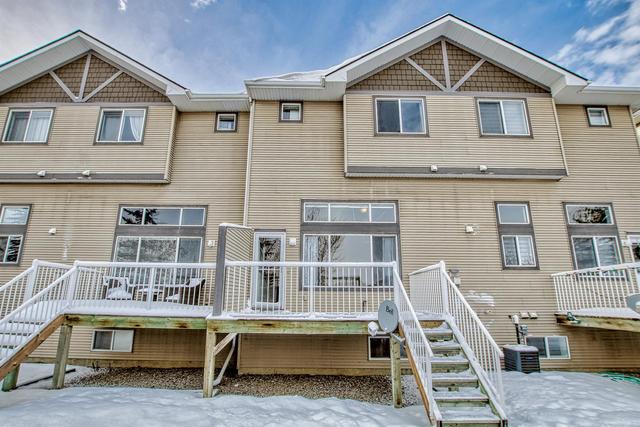 80 Crystal Shores Cove, Home with 3 bedrooms, 2 bathrooms and 2 parking in Calgary AB | Image 48