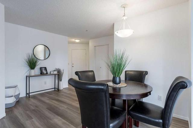 6114 - 304 Mackenzie Way Sw, Condo with 2 bedrooms, 2 bathrooms and 2 parking in Airdrie AB | Image 6