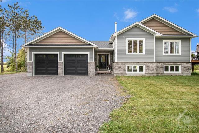 710 Mcfarlane Road, House detached with 3 bedrooms, 2 bathrooms and 8 parking in North Grenville ON | Image 1