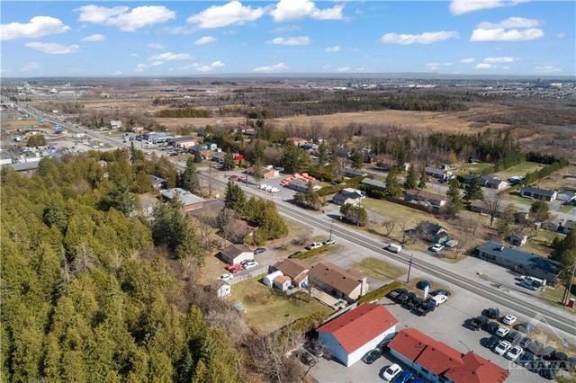 Conveniently located close to shopping, recreation and you can see the on ramp and 417 up in the top left.  House is beside the business with the red room on bottom right. | Image 4