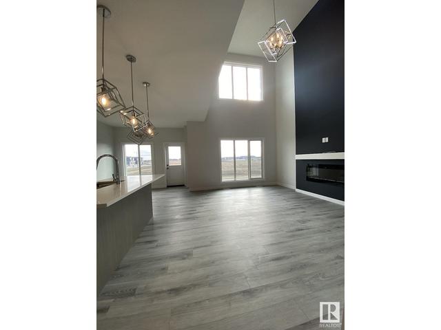 1162 Gyrfalcon Cr Nw, House detached with 7 bedrooms, 4 bathrooms and null parking in Edmonton AB | Image 4