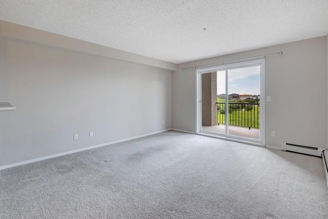 7204 - 304 Mackenzie Way Sw, Condo with 2 bedrooms, 1 bathrooms and 1 parking in Calgary AB | Image 25
