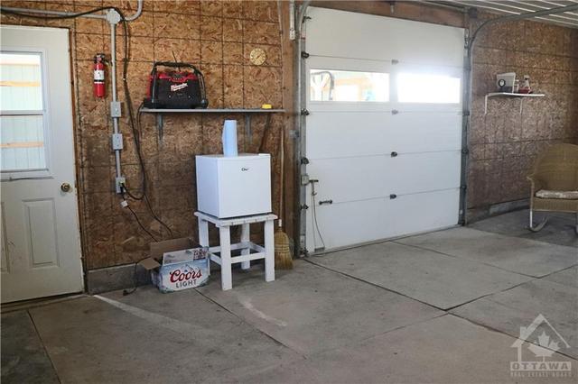 single garage door into the barn/stalls | Image 23