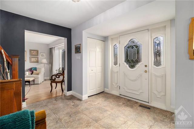 A spacious foyer with double closets | Image 3