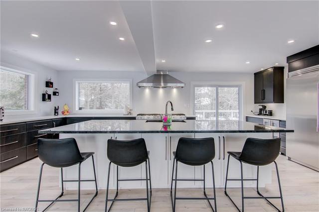 Huge central island w/solid surface countertops! | Image 11
