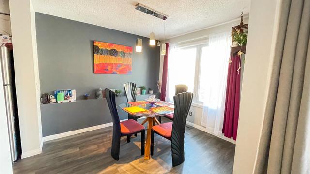 316 Coachway Lane Sw, Home with 3 bedrooms, 2 bathrooms and 2 parking in Calgary AB | Image 6