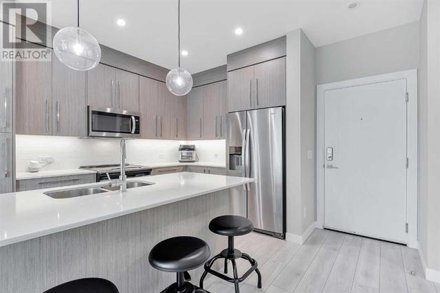 205, - 383 Smith Street Nw, Condo with 2 bedrooms, 2 bathrooms and 1 parking in Calgary AB | Image 4