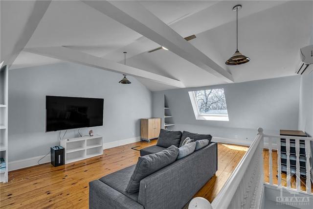 3rd floor living space, the barn style roof allows for height. | Image 27