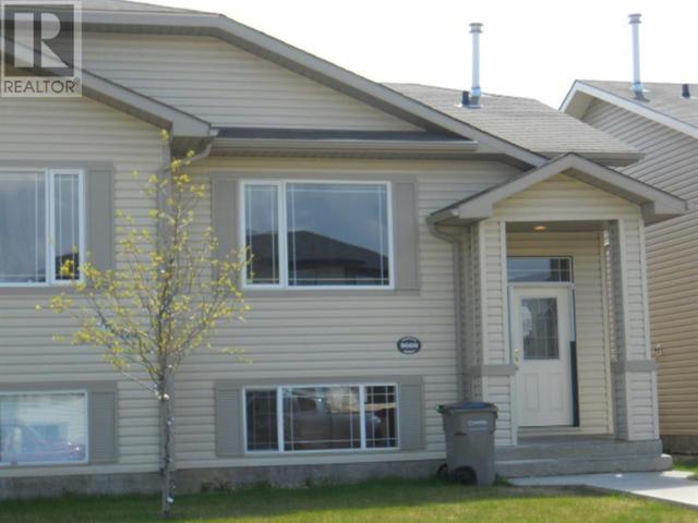 9069 131 Avenue, House semidetached with 4 bedrooms, 2 bathrooms and 2 parking in Grande Prairie AB | Image 1