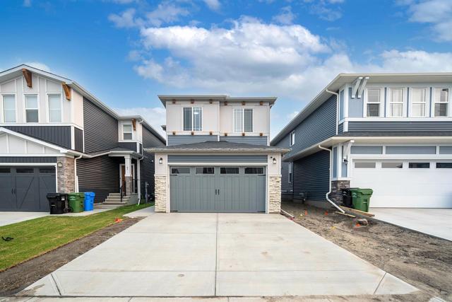 65 Carringsby Way Nw, House detached with 3 bedrooms, 2 bathrooms and 2 parking in Calgary AB | Image 2