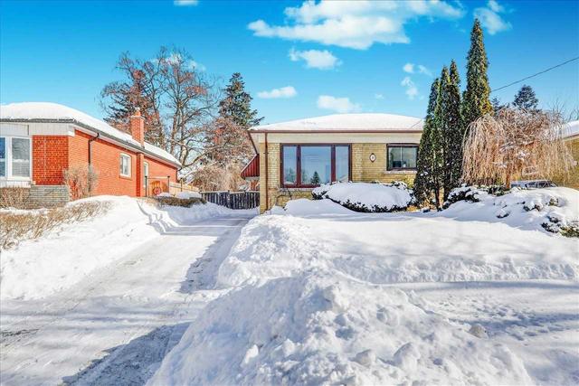 14 Grassington Cres, House detached with 3 bedrooms, 1 bathrooms and 4 parking in Toronto ON | Image 1