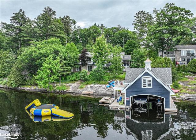 Your Muskoka Paradise with 150 feet of private shoreline to enjoy along with a two-slip boathouse and water trampoline. | Image 1