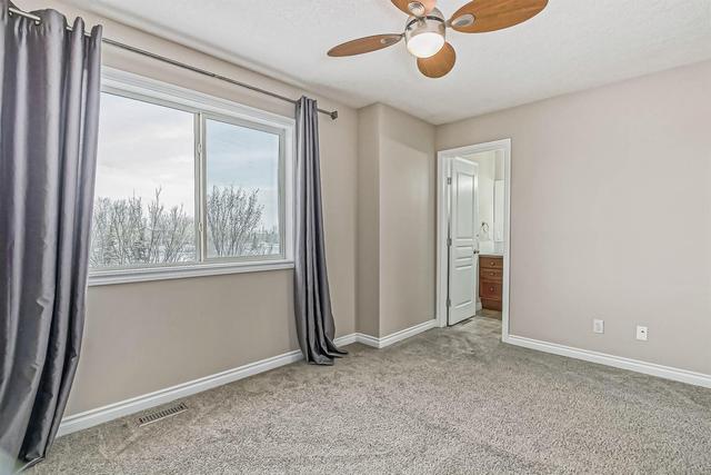 80 Crystal Shores Cove, Home with 3 bedrooms, 2 bathrooms and 2 parking in Calgary AB | Image 25
