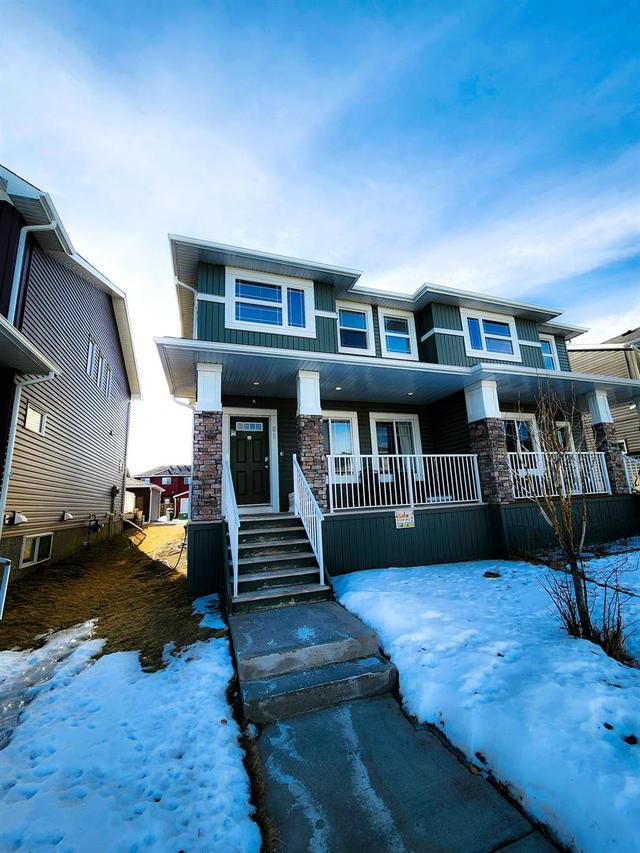 81 Redstone Common Ne, Home with 3 bedrooms, 2 bathrooms and 2 parking in Calgary AB | Image 1