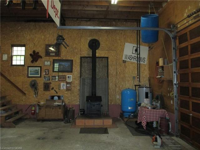 Downstairs woodstove and water tank | Image 17