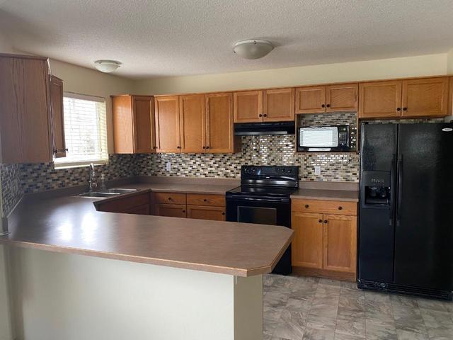 202 - 7129 Riverside Drive, Condo with 2 bedrooms, 2 bathrooms and null parking in Grand Forks BC | Image 1
