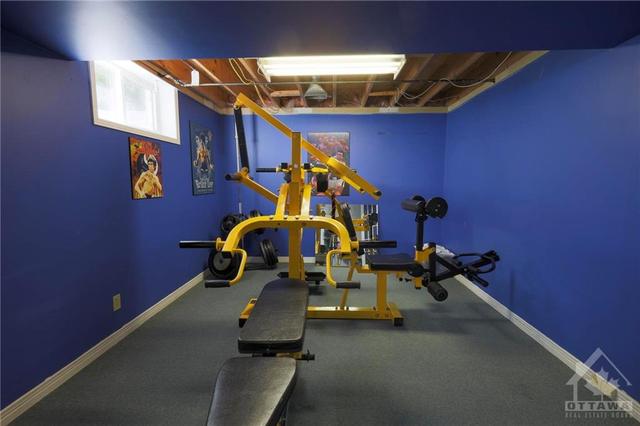 Playroom, craft room, den, gym, lots of possibilities for this room in the basement | Image 25