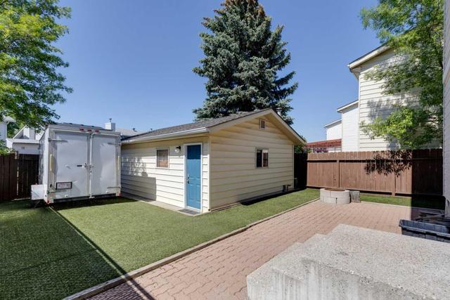Heated & Insulated Double Detached Garage with Alley Access and Additional RV Parking | Image 19