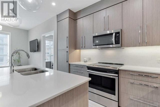 205, - 383 Smith Street Nw, Condo with 2 bedrooms, 2 bathrooms and 1 parking in Calgary AB | Image 7