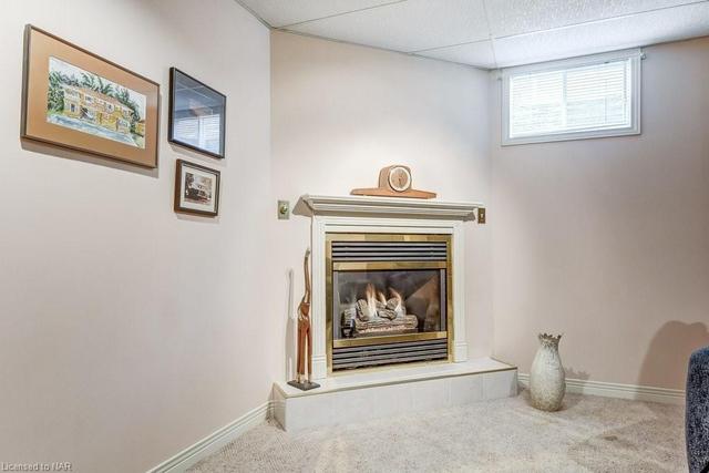 Basement features gas fireplace | Image 15