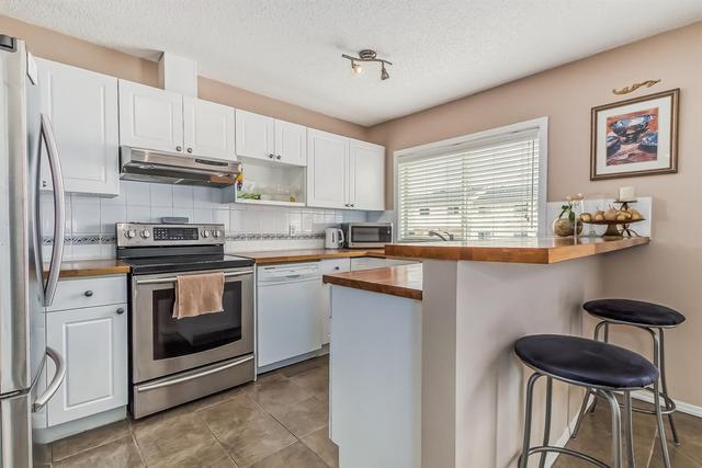 19 Millrose Place Sw, Home with 3 bedrooms, 2 bathrooms and 2 parking in Calgary AB | Image 6