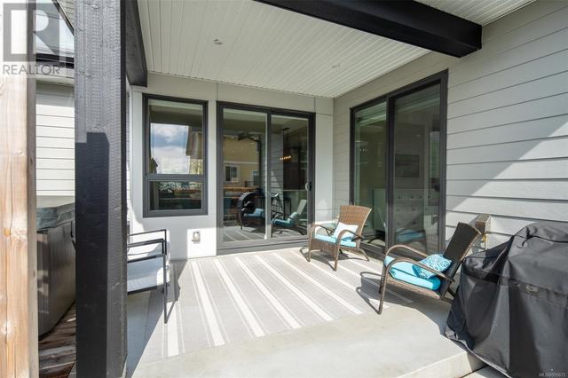 Covered patio accessible from primary suite and kitchen | Image 23