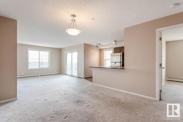 318 - 11808 22 Av Sw, Condo with 2 bedrooms, 2 bathrooms and 1 parking in Edmonton AB | Card Image