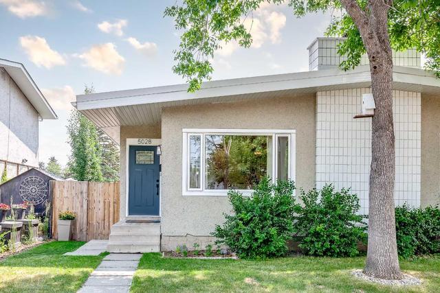 5028 North Haven Drive Nw, Home with 4 bedrooms, 2 bathrooms and 2 parking in Calgary AB | Image 1