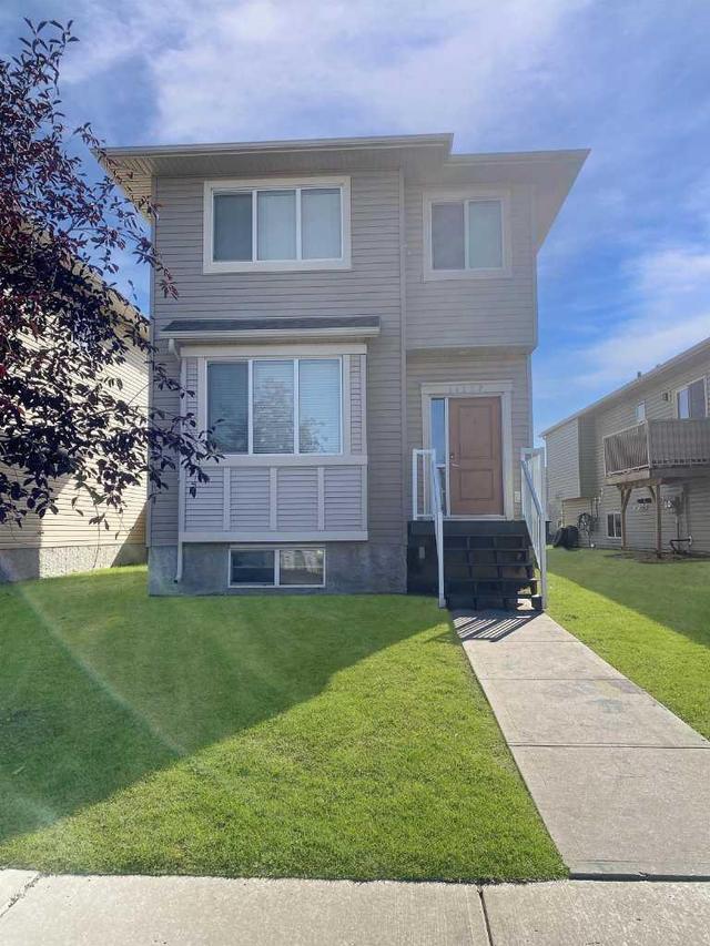 11227 75a Avenue, Home with 4 bedrooms, 3 bathrooms and null parking in Grande Prairie AB | Image 1