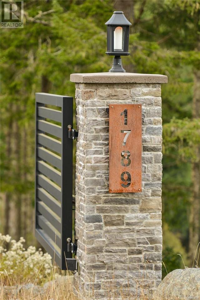 Modern Style Metal Security Gate on Stone Pillars at Property Entrance | Image 66