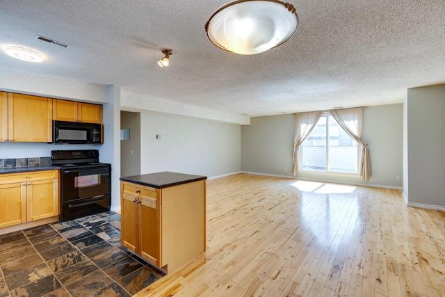 112 - 1540 29 Street Nw, Condo with 2 bedrooms, 1 bathrooms and 1 parking in Calgary AB | Image 2