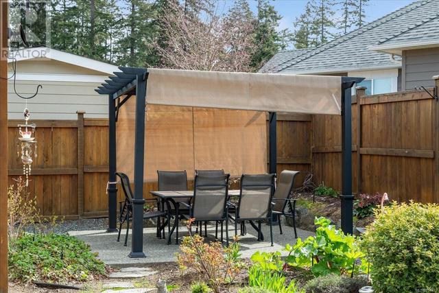 Timberframe style cover over the stamped concrete patio | Image 42