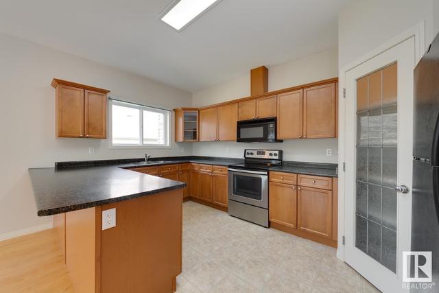 8206 103 Av Nw, House attached with 3 bedrooms, 2 bathrooms and null parking in Edmonton AB | Image 8
