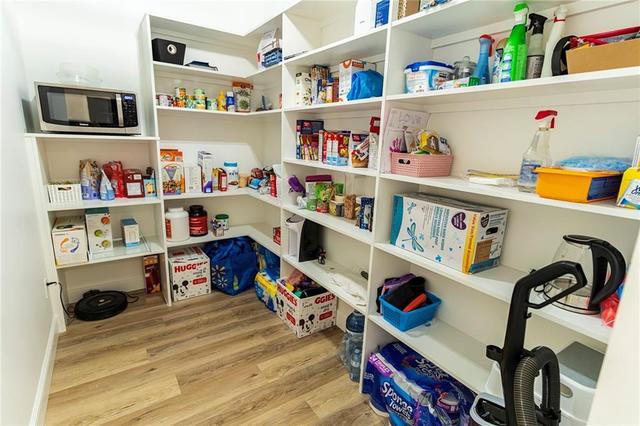Pantry located off the kitchen. | Image 13
