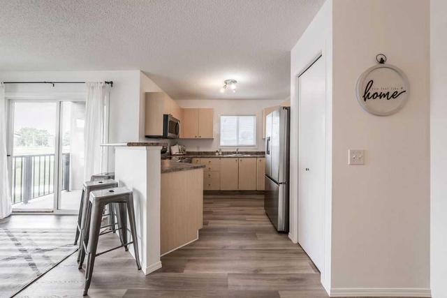 6114 - 304 Mackenzie Way Sw, Condo with 2 bedrooms, 2 bathrooms and 2 parking in Airdrie AB | Image 7