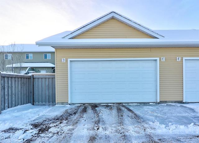 8766 72 Avenue, Home with 4 bedrooms, 3 bathrooms and 2 parking in Greenview No. 16 AB | Image 26