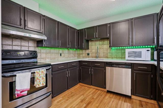 56 - 23 Glamis Drive Sw, Home with 3 bedrooms, 2 bathrooms and 2 parking in Calgary AB | Image 8